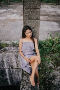 woman-posing-on-a-concrete-post-3285405