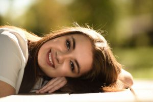 close-up-photography-of-woman-laying-on-table-755280